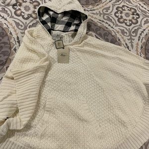 Cream poncho with buff check hood lining